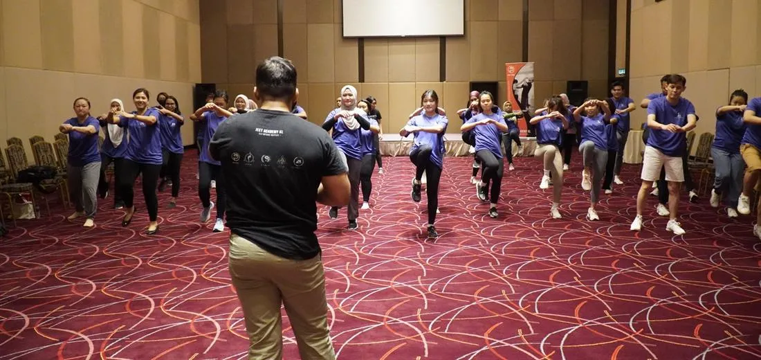 A large corporate team at a JEET Academy KL self-defence workshop